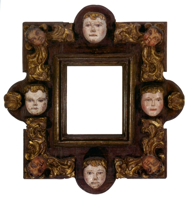 At Lowy, we’re visual people, and we love faces. This small late 17th-early 18th century carved, gilt and polychrome frame contains shells and painted masks connected to cherub heads and stylized scrolling leaf carvings. 